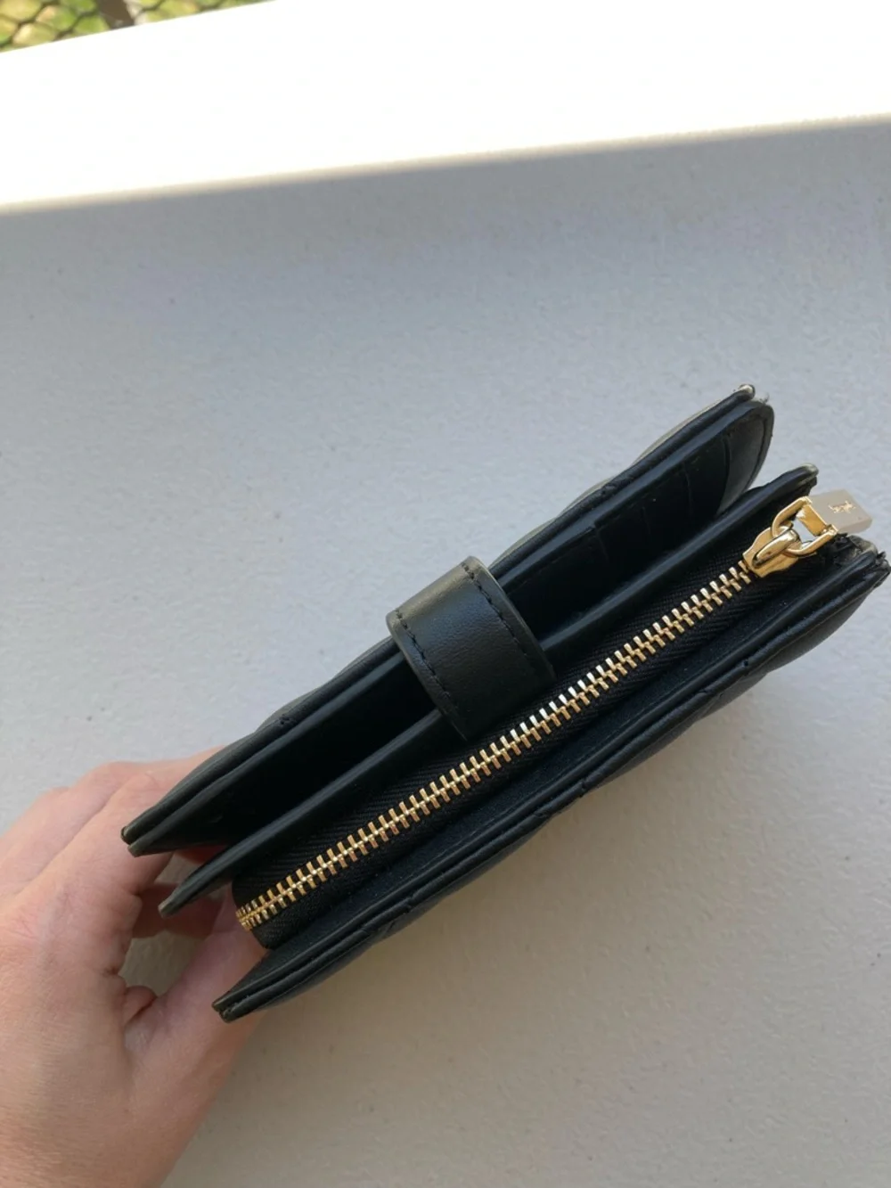 Kate Spade New York Carey Medium Compact Bifold Wallet in Black Quilted Leather